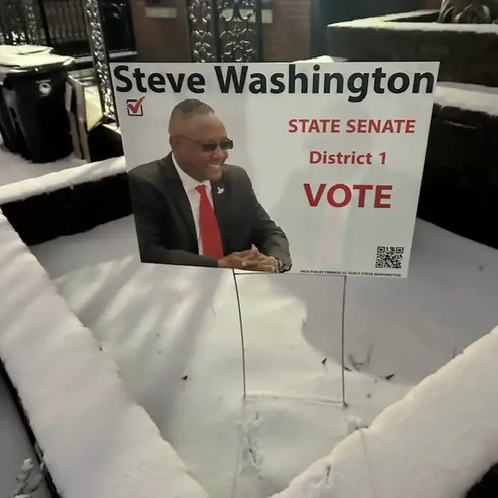 A Steve Washington State Senate District 1 yard sign in the snow